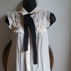Sleeveless Ruffled Cream Blouse With Bow Tie
